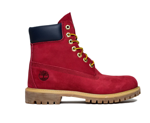 Red boot with gold laces on a white background