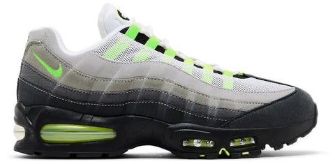 Gray and black sneaker with neon green accents on a white background