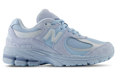 Light blue sneaker with New Balance logo on a white background