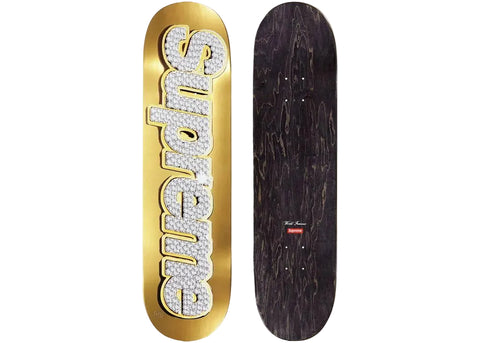 Skateboard with 'Supreme' logo on a gold background and black deck.